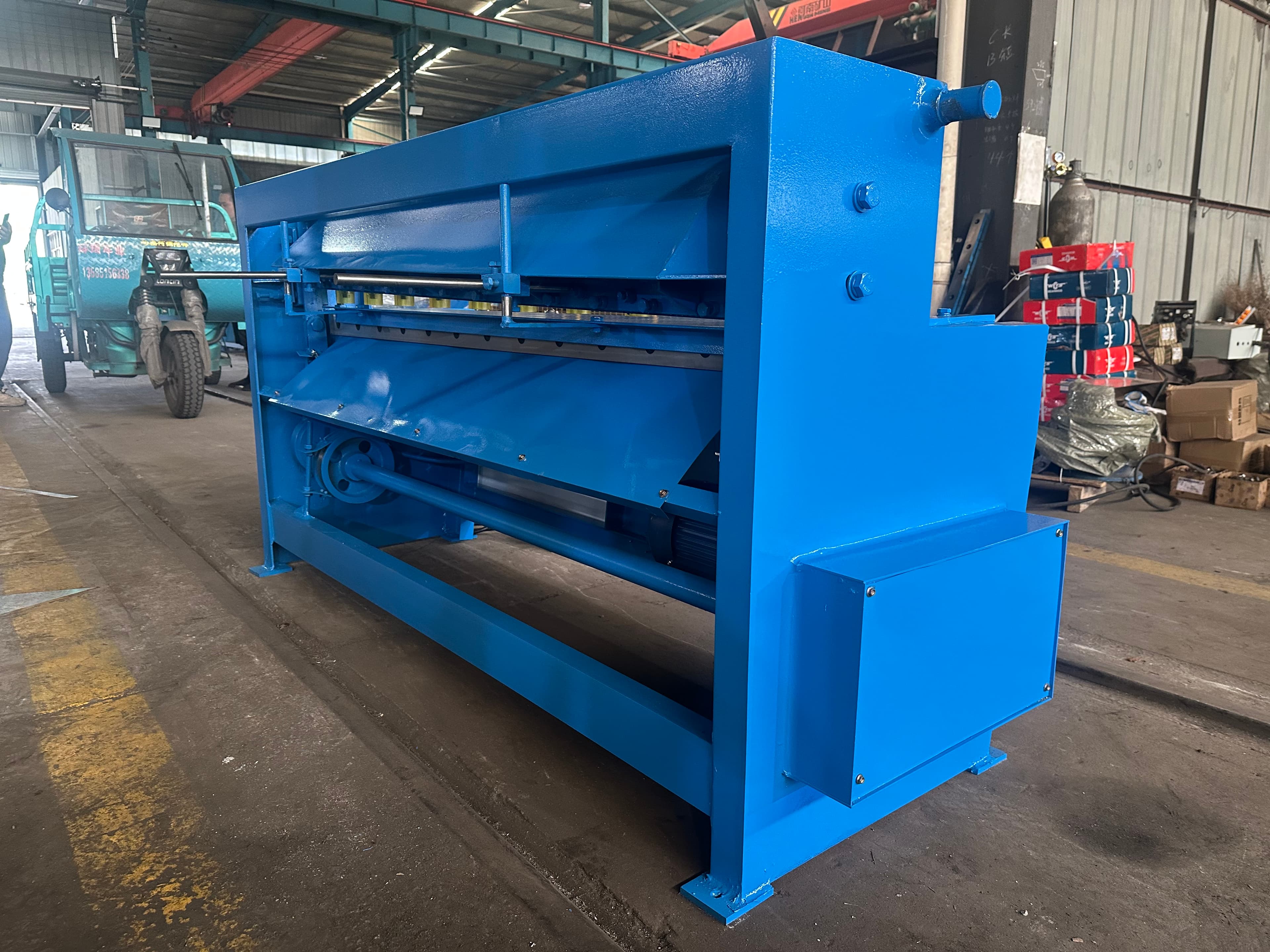 Rear drive and transmission assembly on a sheet metal machine
