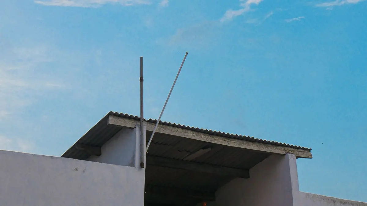 Installed corrugated metal roof beneath a blue sky