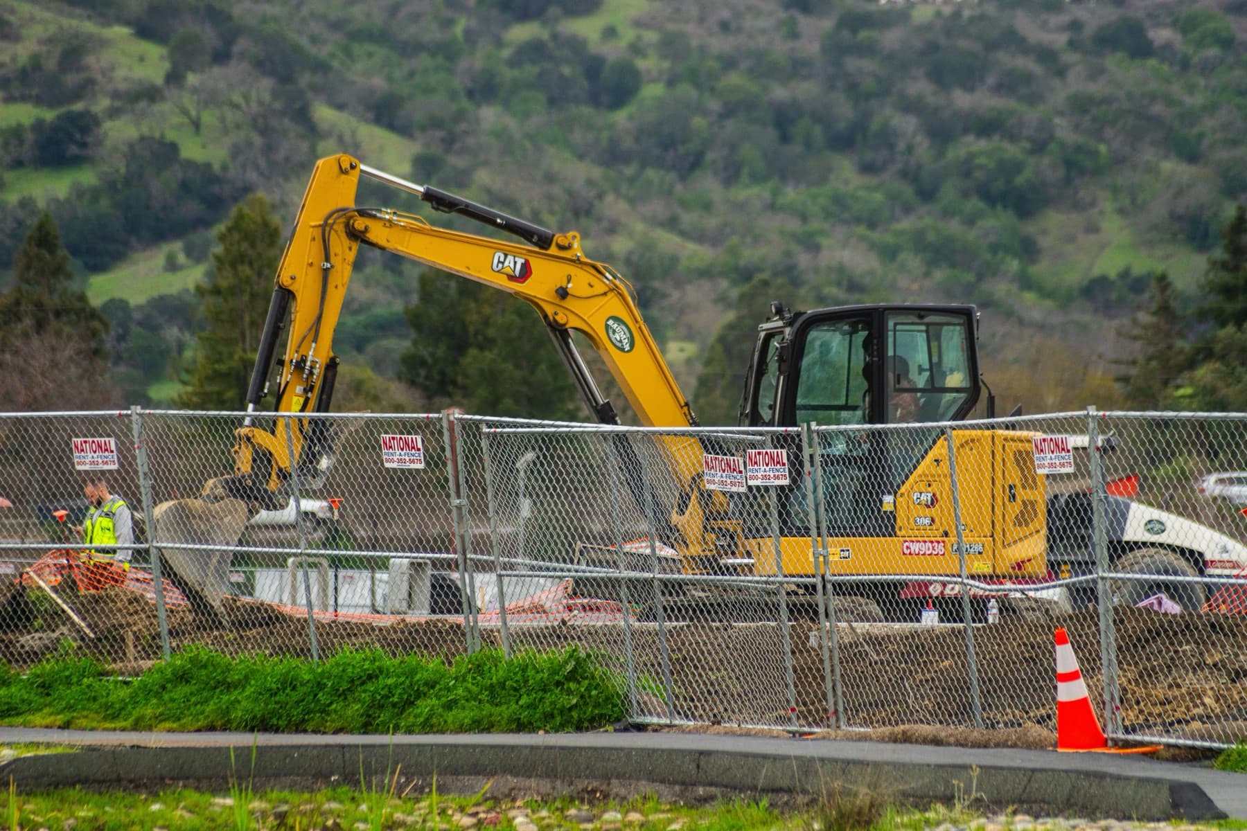 Real construction machinery operating on a work site