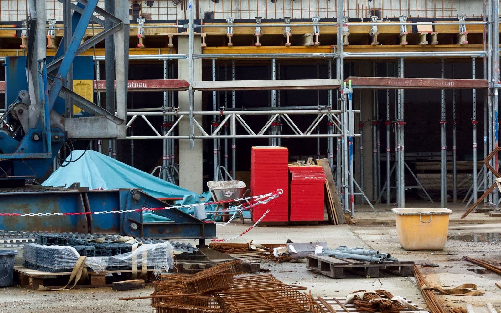 Real construction machinery and heavy steel fabrication environment