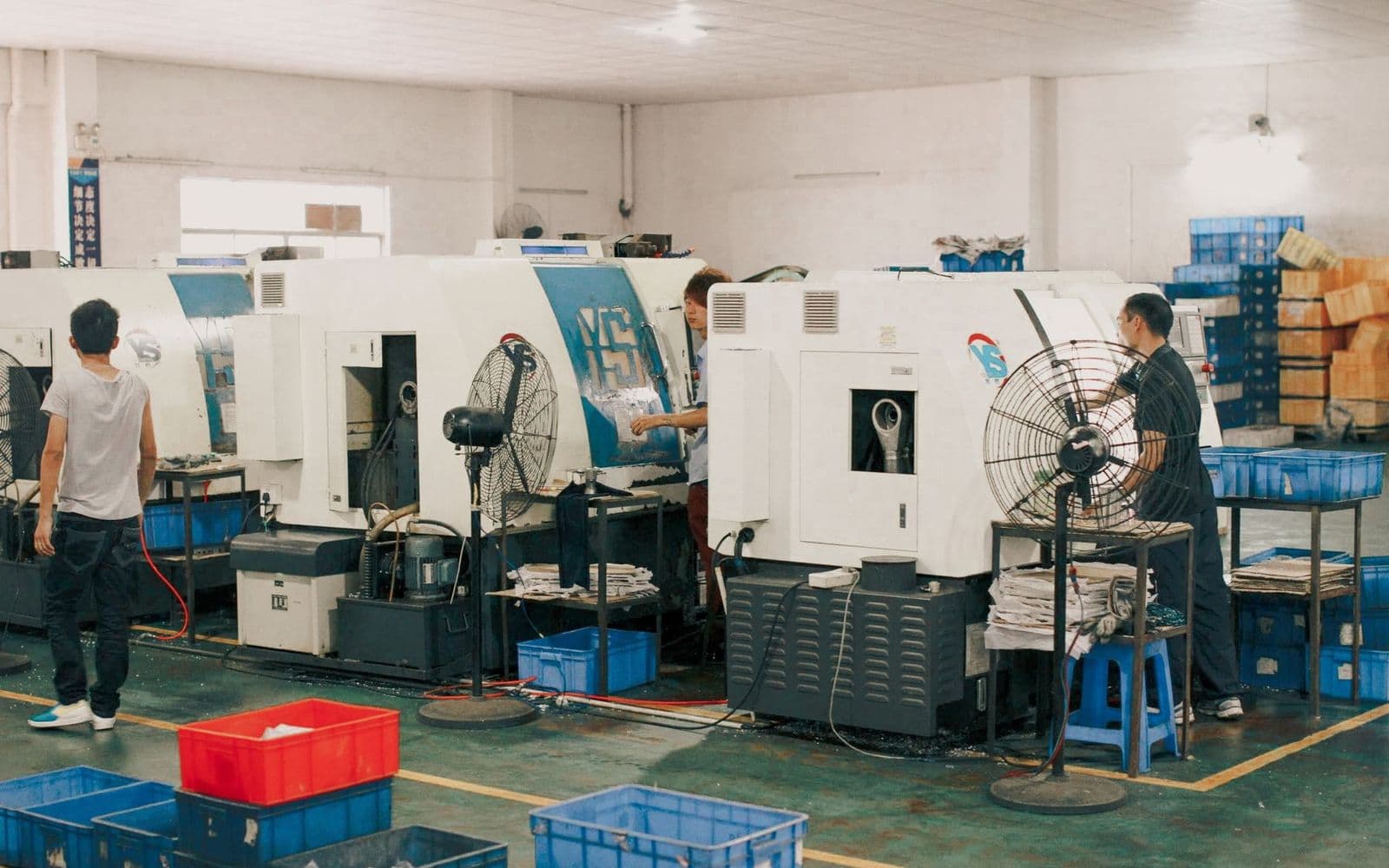 Real heavy fabrication workshop with industrial workers