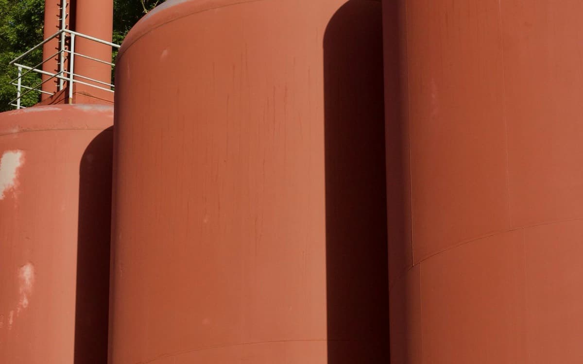 Real red industrial storage tank shells